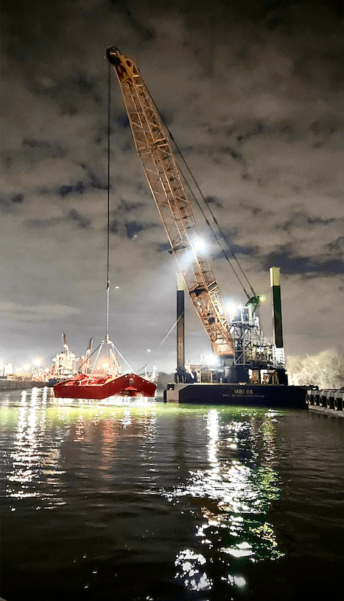 Unloading barge working through the night